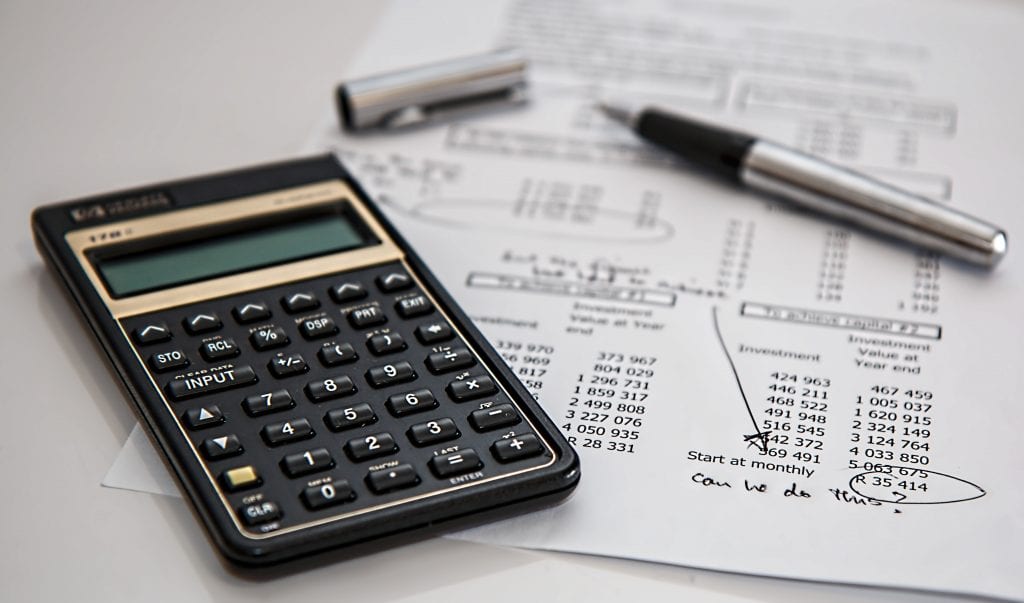 pen and calculator and paper