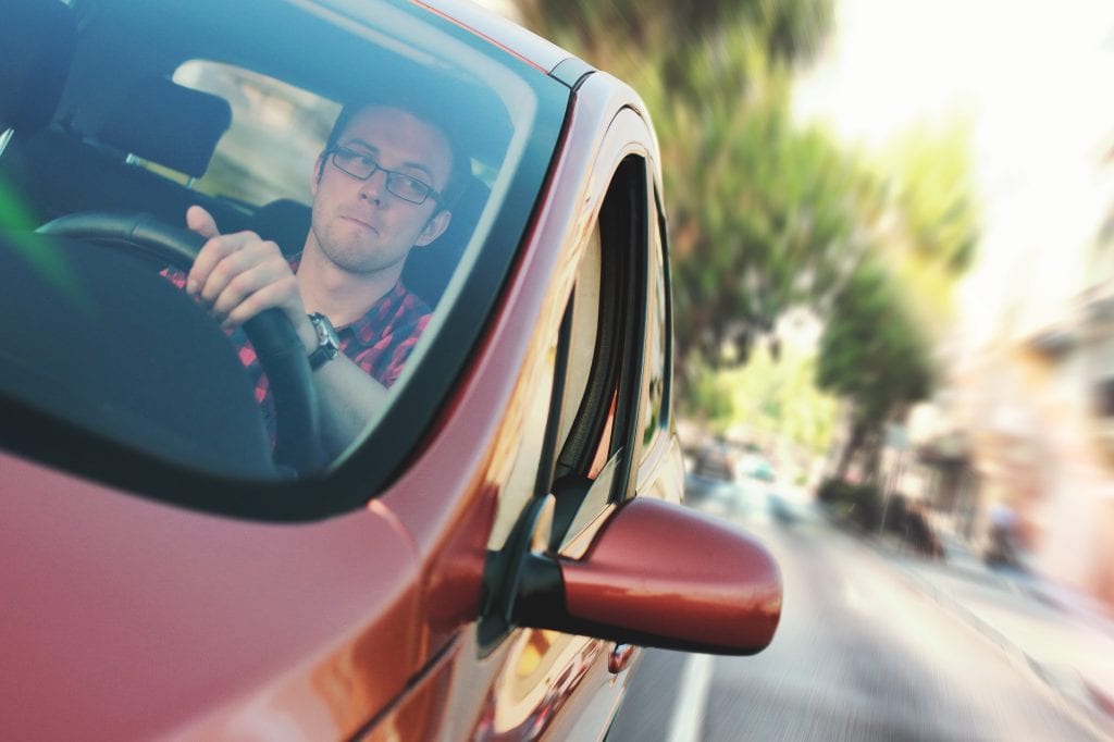 photo of a driver behind the wheel